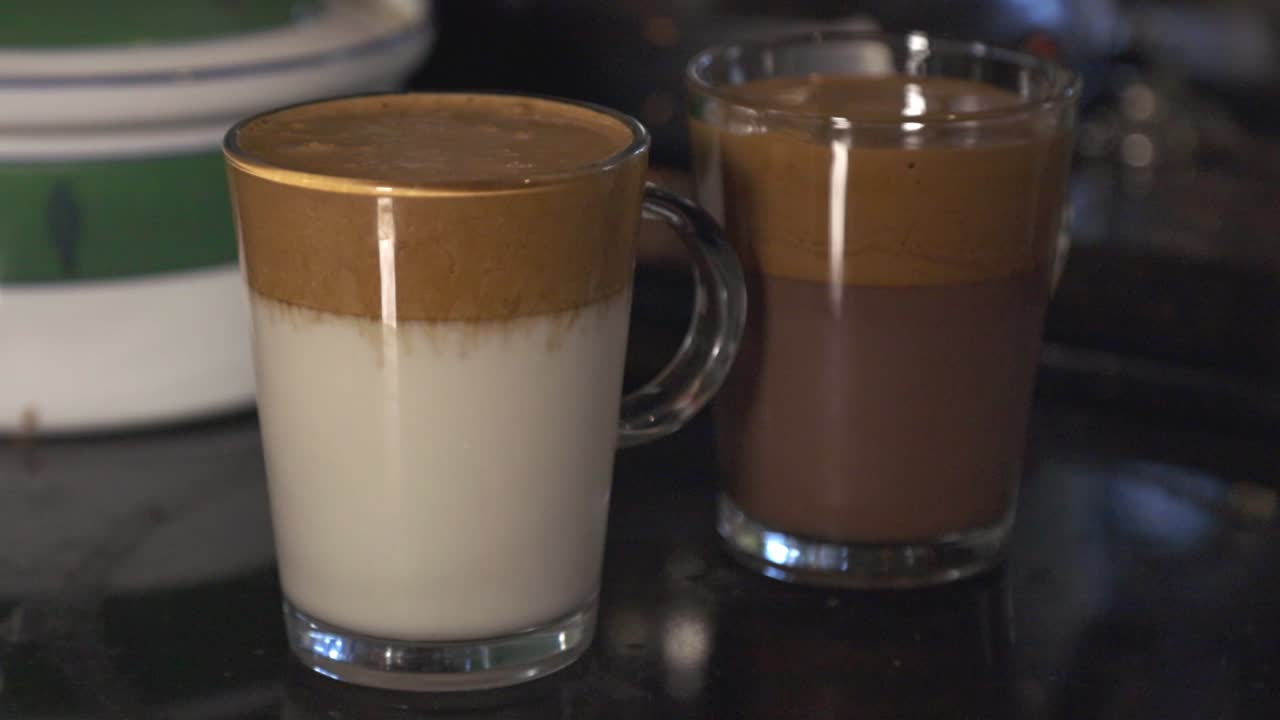 Two Delicious Glass Of Chocolate And Milk Layered Latte.- closeup shot