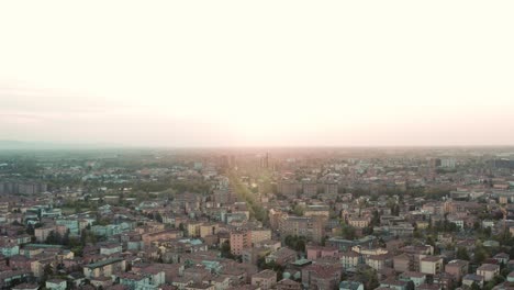 aerial – cinematic pedestal movement in a city during the sunset