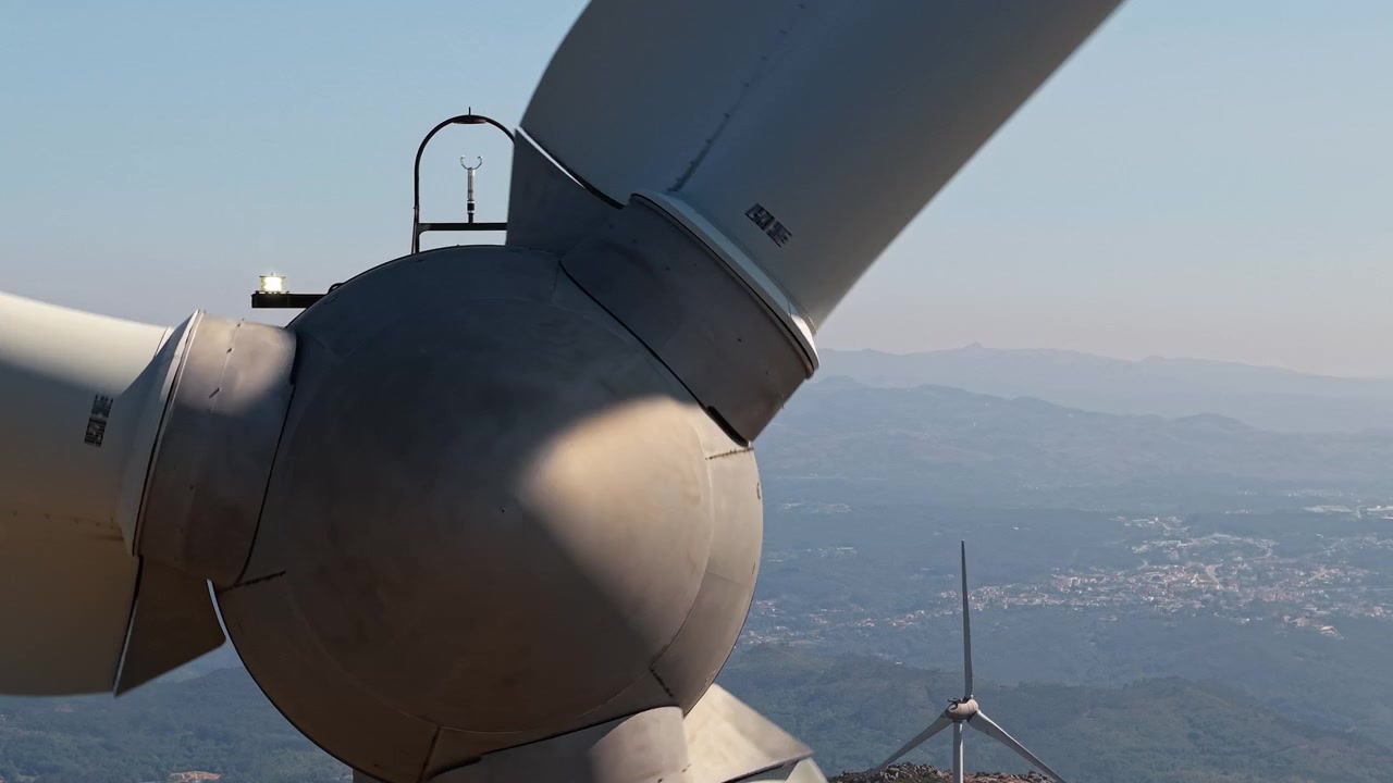 Extreme close view of wind turbine hub and blade connections