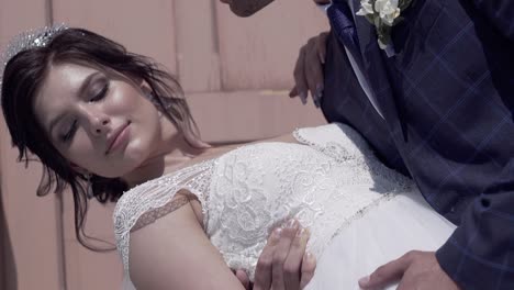 wonderful bride in handsome man hands slow motion closeup