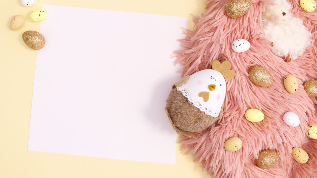Pastel pink and gold arrangement for Easter with paper card note. Stop motion flat lay
