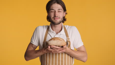 caucasian man in front of camera on yellow background.