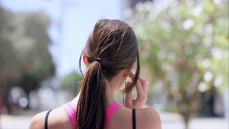 Rear-view-Athletic-running-fitness-woman-in-urban-city-slow-motion