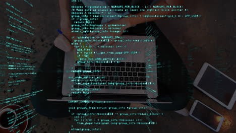Data processing against top view of woman using laptop