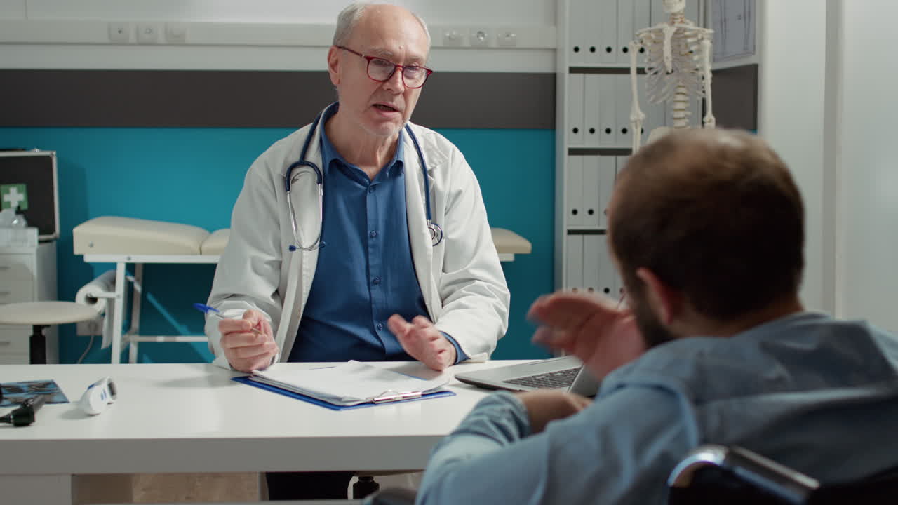 Health specialist doing consultation with wheelchair user