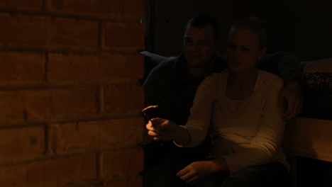 Couple-warming-near-stove