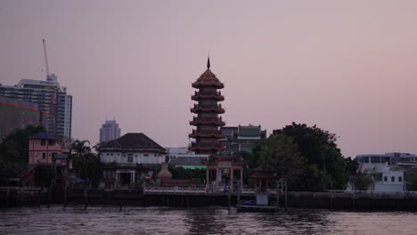 sunset pagoda on the river in thailand