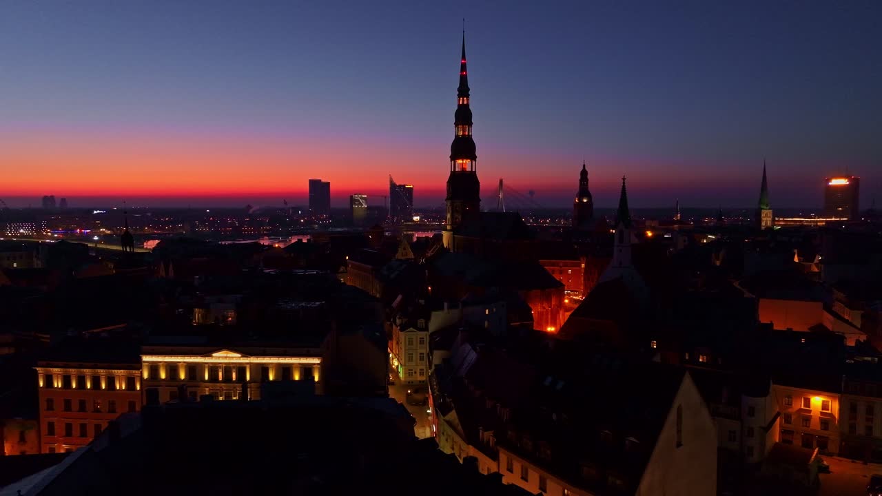 Stunning aerial of Riga’s Old Town, modern skyline, vibrant city lights, sunset