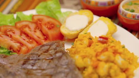 hispanic steak with white corn and potatoes