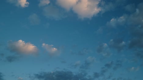 clouds floating across the sky in a calming timelapse sequence with blue tones