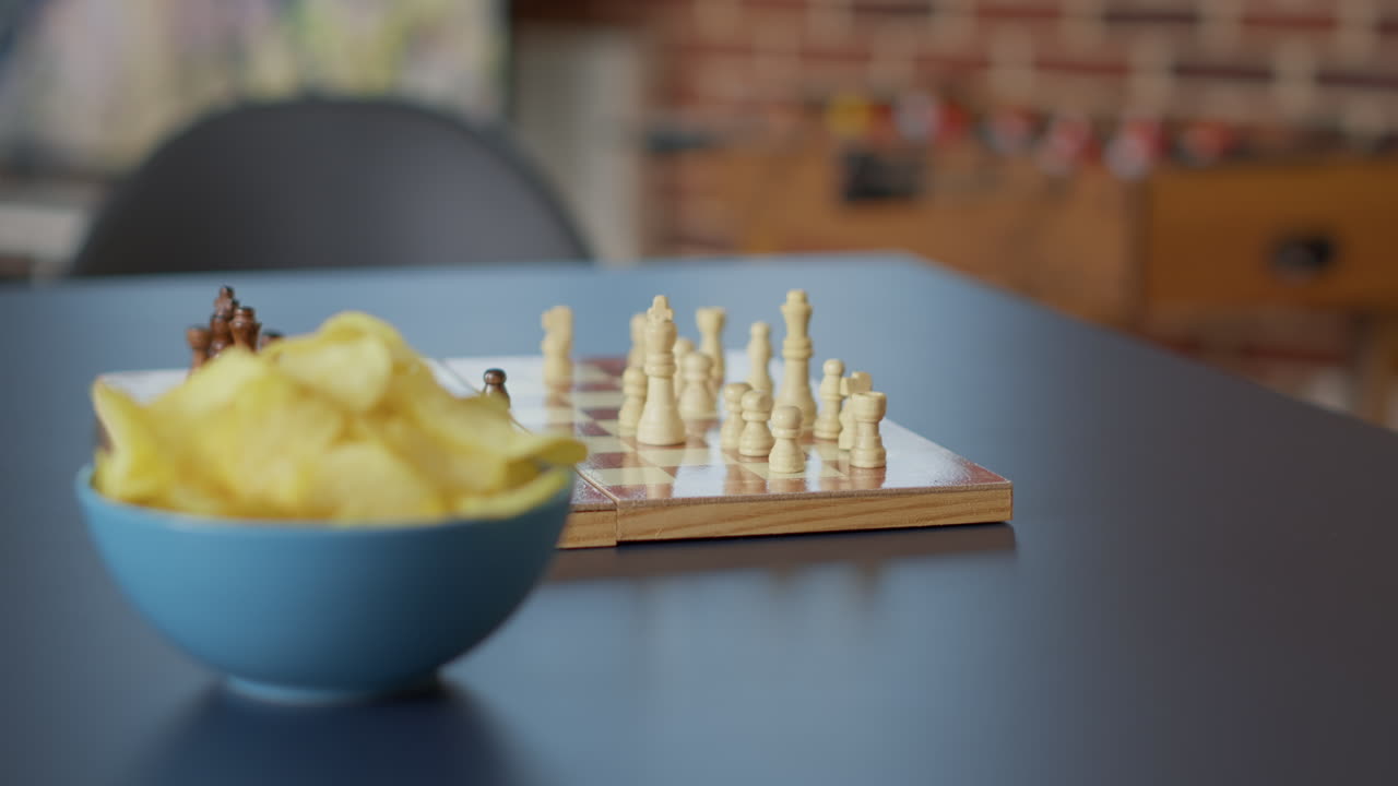 Nobody in apartment with snacks and wooden board games