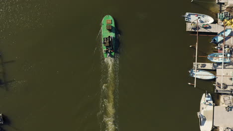 Flat-bottomed-oyster-boat-with-oyster-bags-and-fishermen-aerial-vertical-view