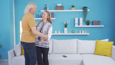 The-man-who-greets-his-wife-when-she-comes-home.-Happy-couple.