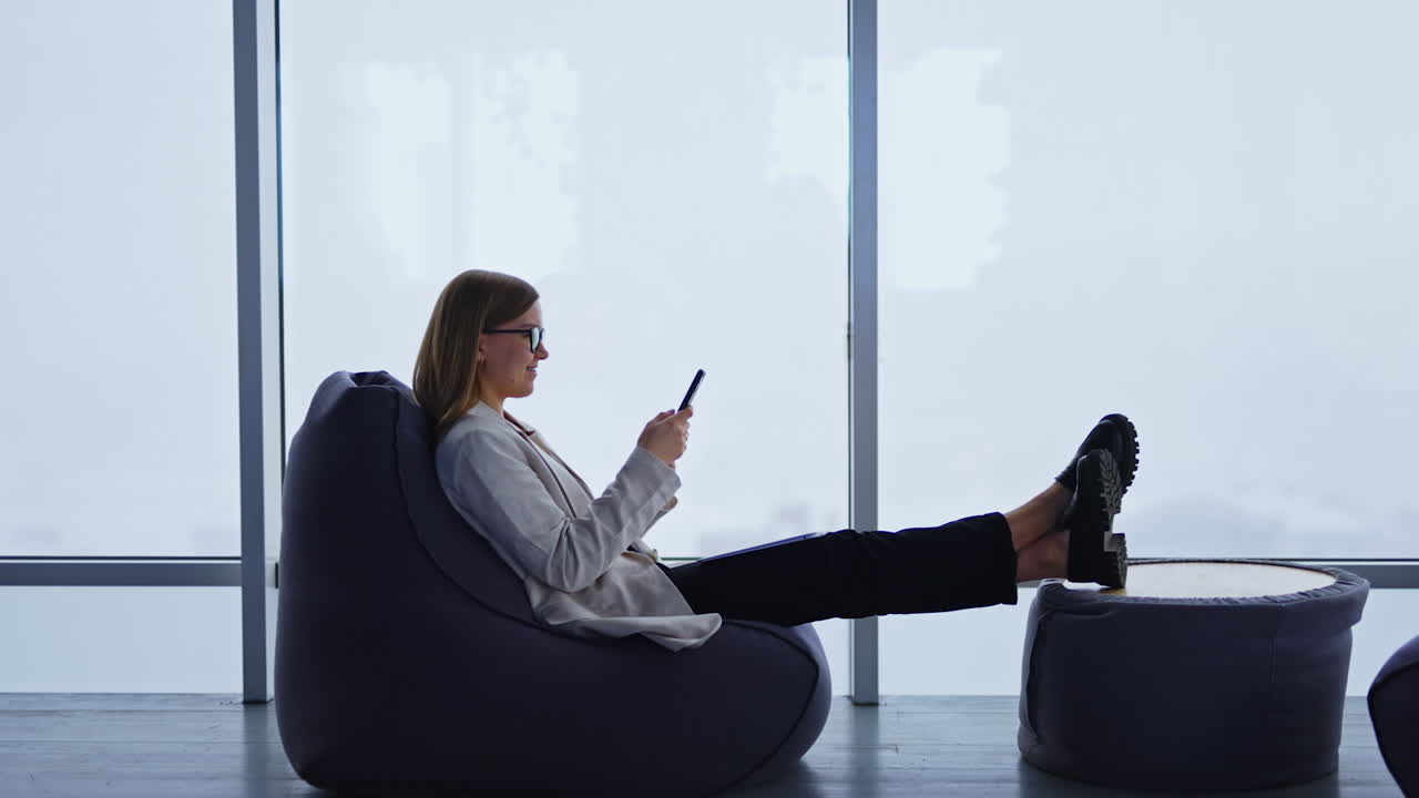 Woman Relaxing in Bean Bag Chair