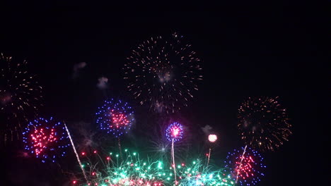 Beautiful-abstract-colourful-Fireworks-explode-display-on-sky-at-night-a-symbol-of-celebration-in-New-years-anniversary-for-background