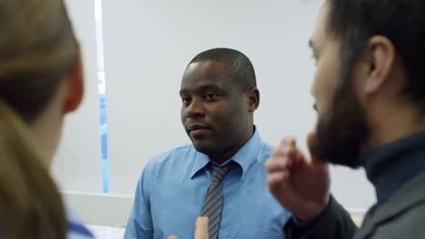 african businessman chatting with partners