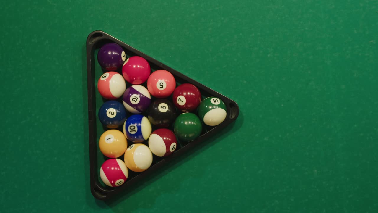 Pool Balls in a Rack on a Green Pool Table