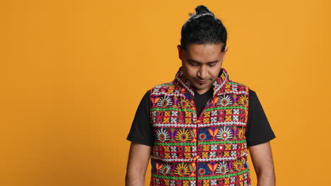 person in traditional attire feeling carefree, studio background