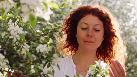 woman in a spring blossom garden