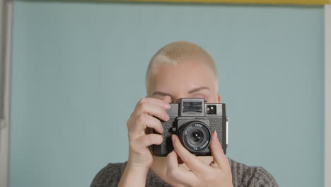 female photographer poses with vintage camera 07