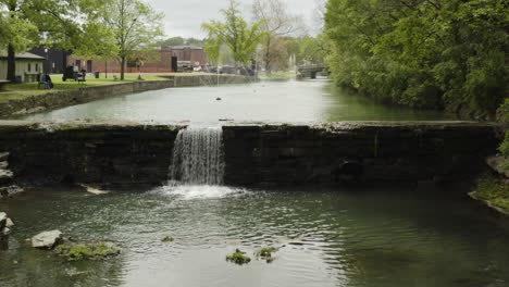 aerial - sager creek in siloam springs, arkansas, wide shot lowering