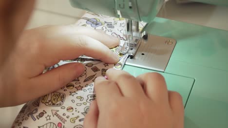 Woman-sewing-DIY-Corona-Mask-at-Home