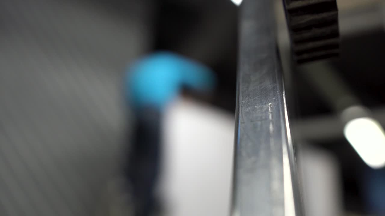 Worker Installing a Panel on a Wall