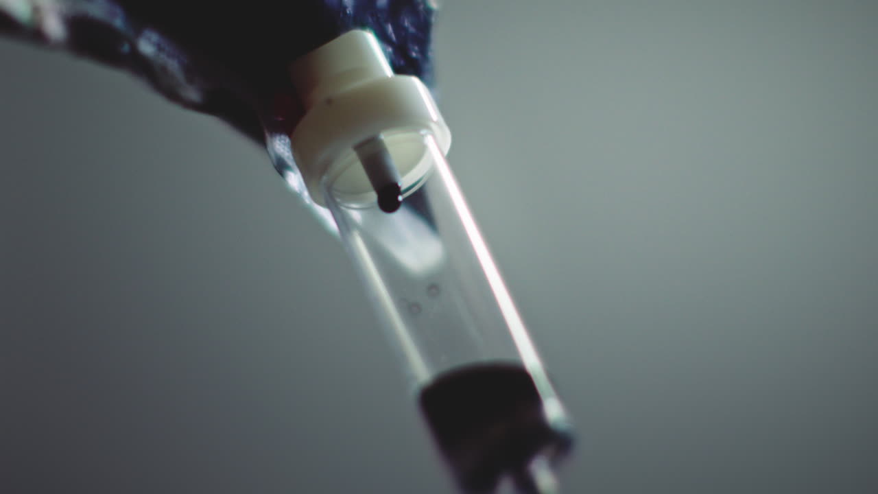 Dark liquid is dripping slowly