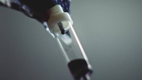 dark liquid is dripping slowly