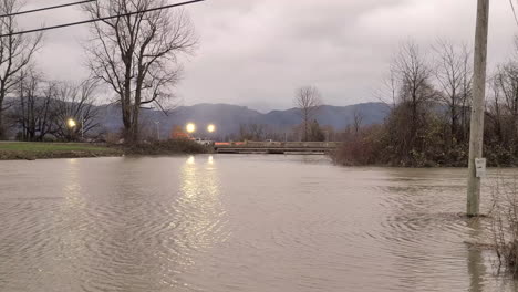 telephone poles under water due to flooding in rural area