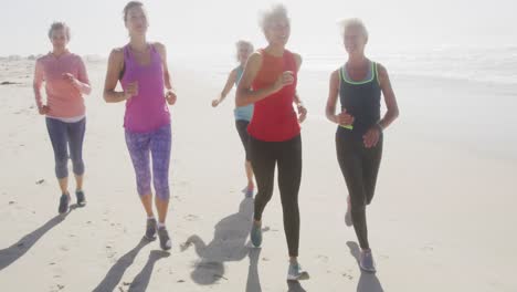 senior women running on the beach