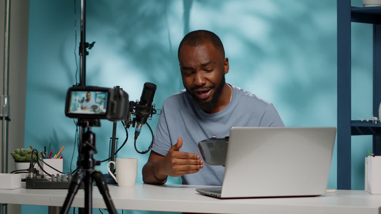 African american influencer reviewing vr glasses on camera