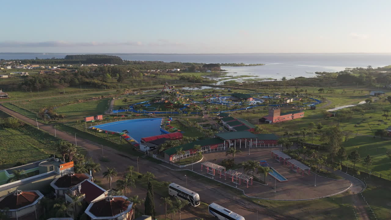 Aerial View of a Water Park near a Lake
