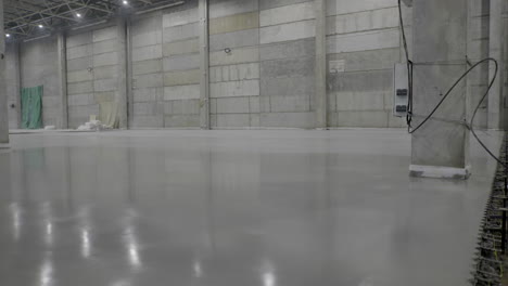 interior of a warehouse under construction with a new concrete floor