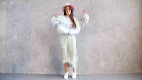 happy woman dancing in a studio