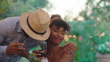 two women making toast drinking wine celebrating at dinner party greeting friends enjoying reunion gathering sitting at table outdoors 4k footage