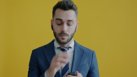 businessman with earbuds