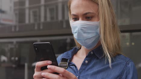 Side-view-of-Caucasian-woman-wearing-a-coronavirus-Covid19-mask