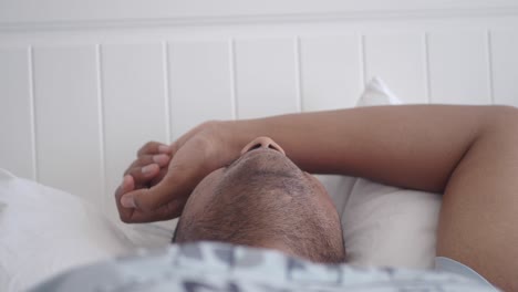 man sleeping in bed