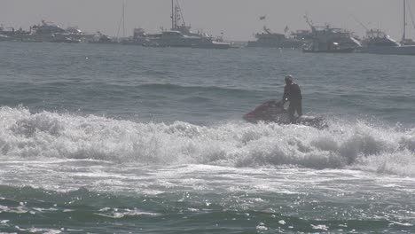 jet ski riding waves 4k