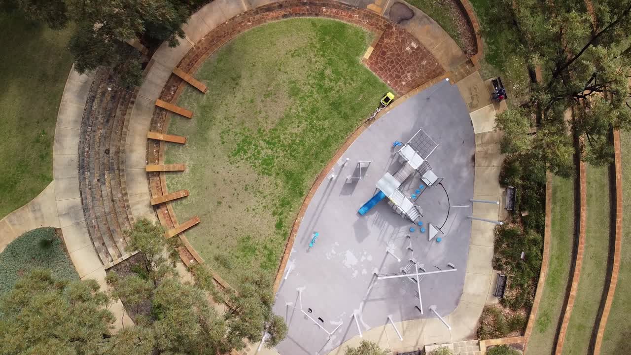Aerial Slow Descending Spin Over Round Outdoor Play Park
