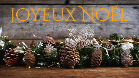 joyeux noã«l written over christmas decorations