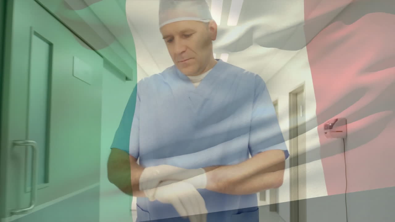 Animation of flag of italy over caucasian male surgeon in hospital