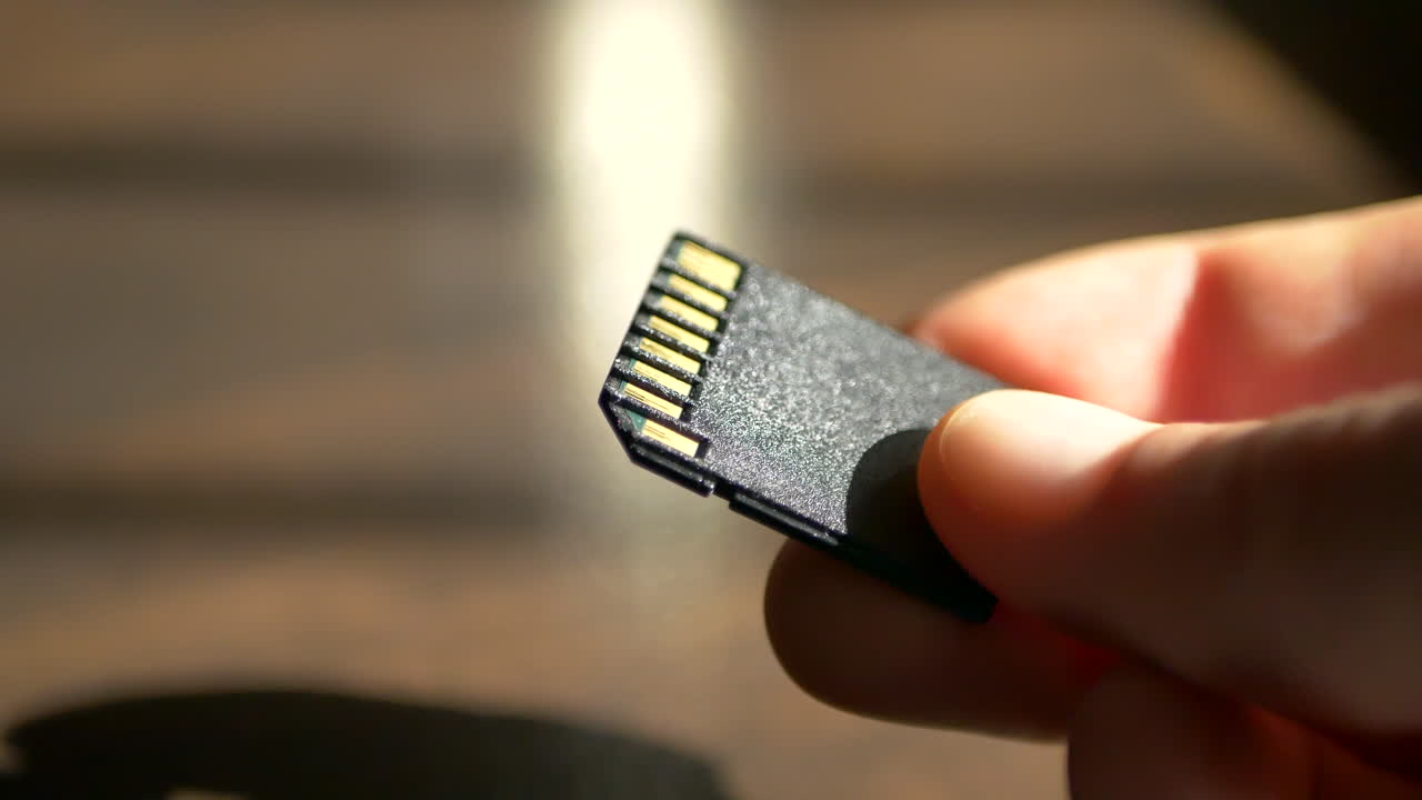 Close up macro shot of a standard SD card for use with data storage, photography, and video cameras for film makers