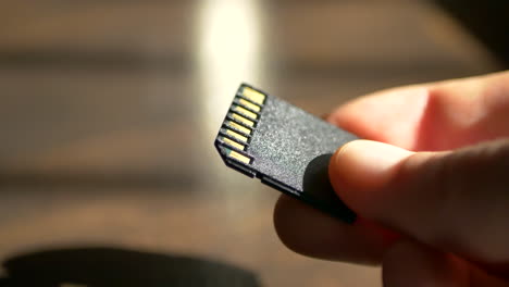 close up macro shot of a standard sd card for use with data storage, photography, and video cameras for film makers