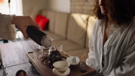 woman enjoying a traditional chinese tea ceremony