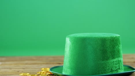 leprechauns hat and gold on table for st patricks