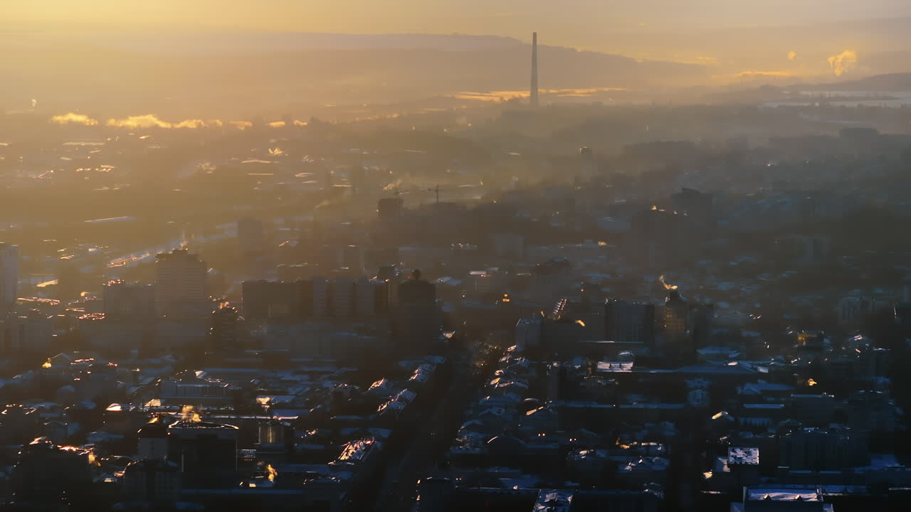 Aerial drone view of the city covered in snow. Sunset during winter in Chisinau, Moldova