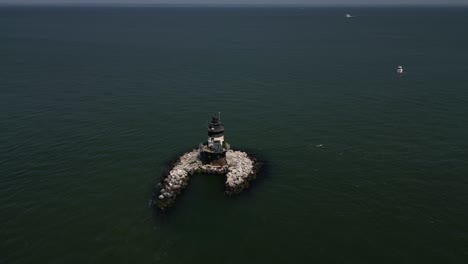 an aerial view the orient point lighthouse off the east end of orient point, ny on a sunny day