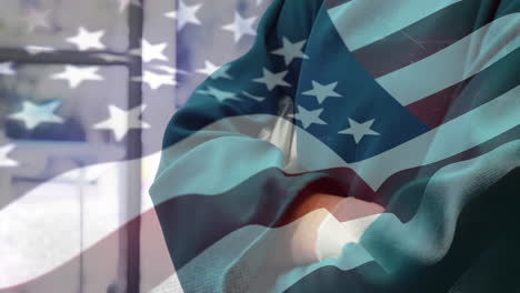 animación de la bandera de los estados unidos ondeando sobre los cirujanos en el quirófano